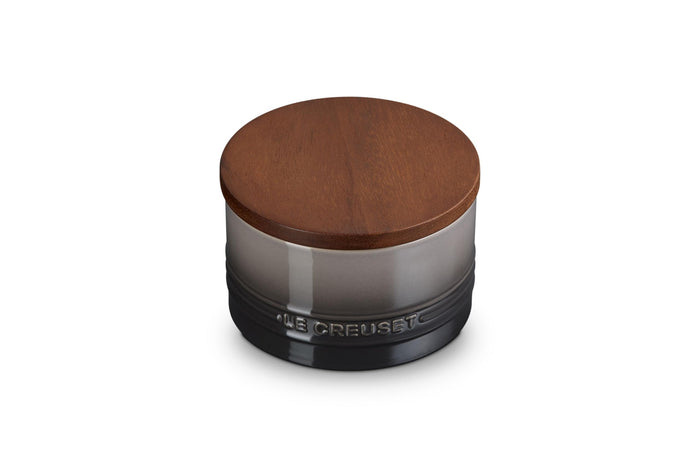 Oyster 16oz Le Creuset Stoneware Signature Canister with a wood lid on a white background
