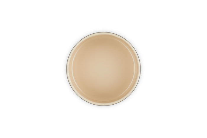 Cream inside of a container on a white background