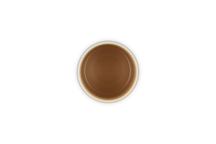 Cream inside of a container on a white background