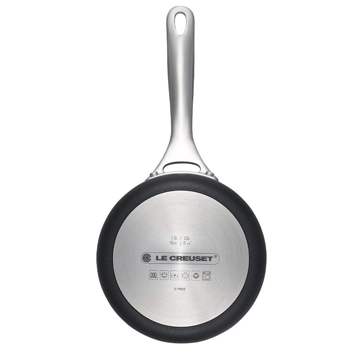 Bottom view of Le Creuset Toughened Nonstick PRO 2 qt. Saucepan displayed vertically on a white background