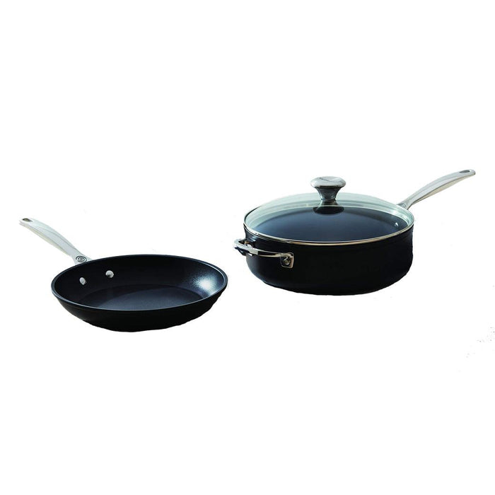 Le Creuset Toughened Nonstick PRO skillet and saucepan with glass lid displayed on a white background