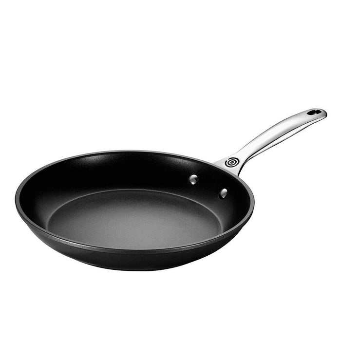 Le Creuset Toughened Nonstick PRO skillet displayed on a white background