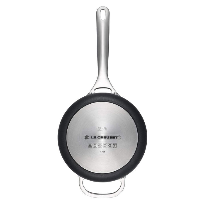 Bottom view of Le Creuset Toughened Nonstick PRO 3 qt. Saucepan displayed vertically on a white background