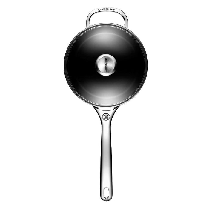 Top view of Le Creuset Toughened Nonstick PRO 3 qt. Saucepan with Glass Lid displayed vertically on a white background