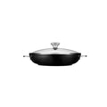 Side view of Le Creuset Toughened Nonstick PRO 4 qt Braiser with Glass Lid displayed on a white background