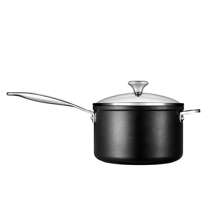 Side view of Le Creuset Toughened Nonstick PRO 4 qt. Saucepan with Glass Lid displayed on a white background