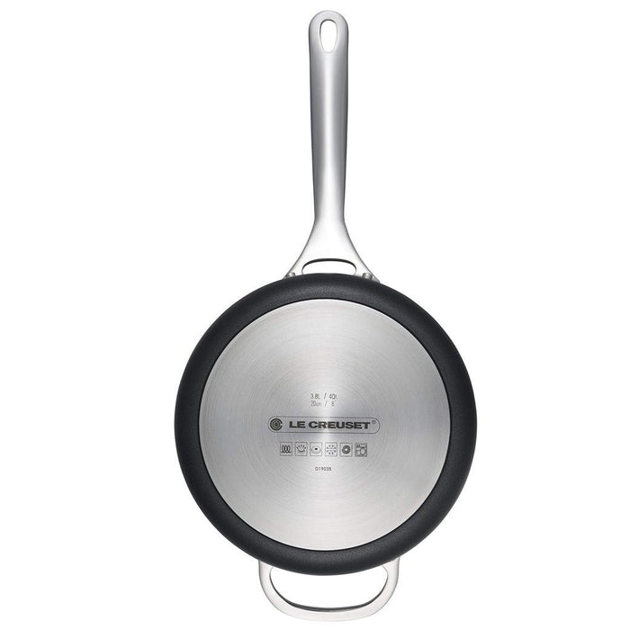 Bottom view of Le Creuset Toughened Nonstick PRO 4 qt. Saucepan displayed vertically on a white background