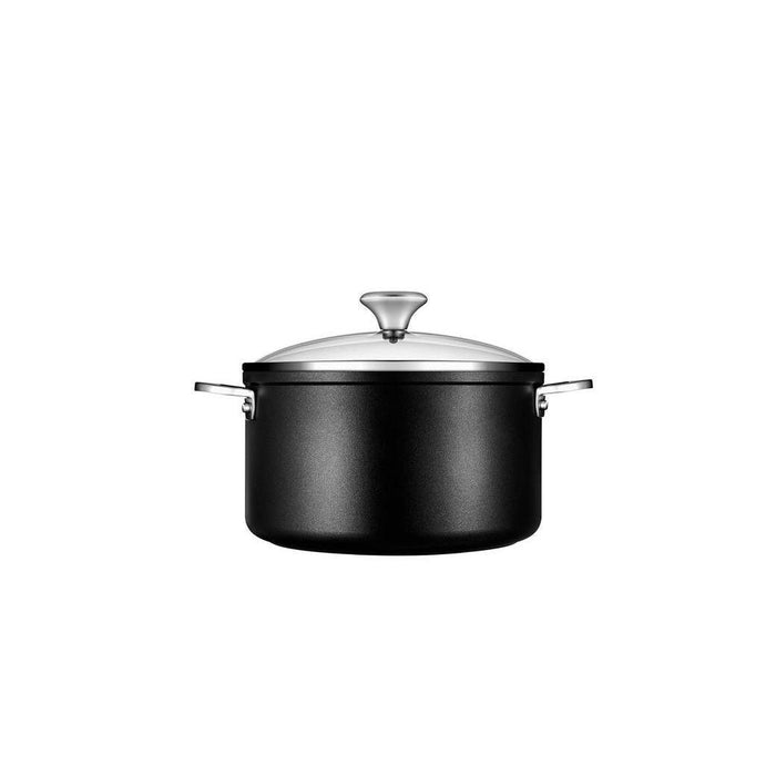 Side view of Le Creuset Toughened Nonstick PRO 6.3 qt Stockpot with Glass Lid displayed on a white background