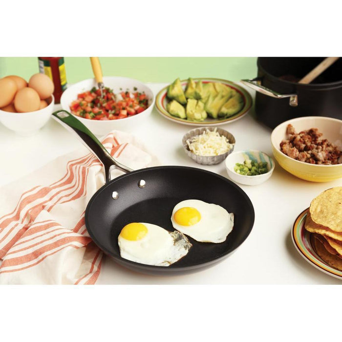Le Creuset Toughened Nonstick PRO Fry Pan with 2 fried eggs on the pan with taco materials in the background