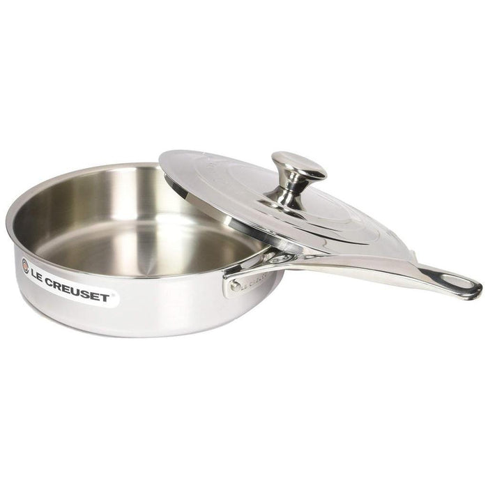 3 qt Le Creuset tri ply stainless steel saute pan with lid displayed on a white background