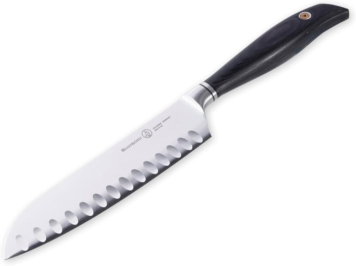 Santoku knife with a black handle on a white background