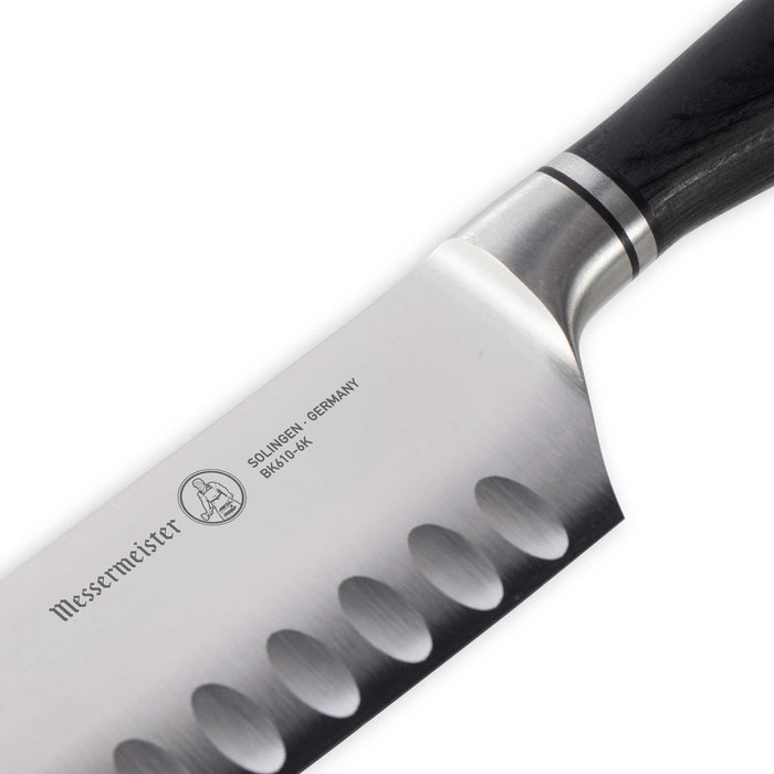 Knife blade with 'Messermeister' branding on a white background