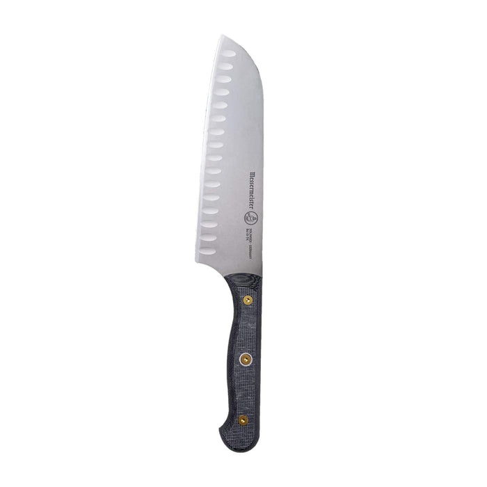 Serrated knife with a black handle on a white background