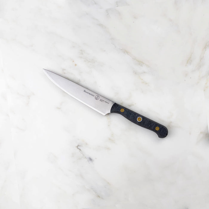 6 inch utility knife displayed on a marble surface