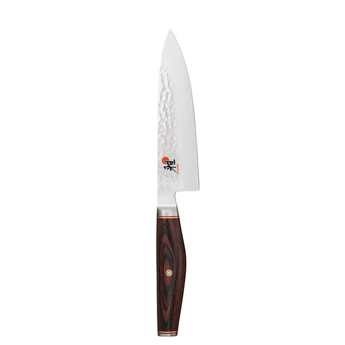 6 inch Miyabi Artisan Chef's Knife displayed vertically on a white background