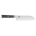 5.5 inch Miyabi Kaizen Hollow Edge Santoku Knife displayed horizontally on a white background