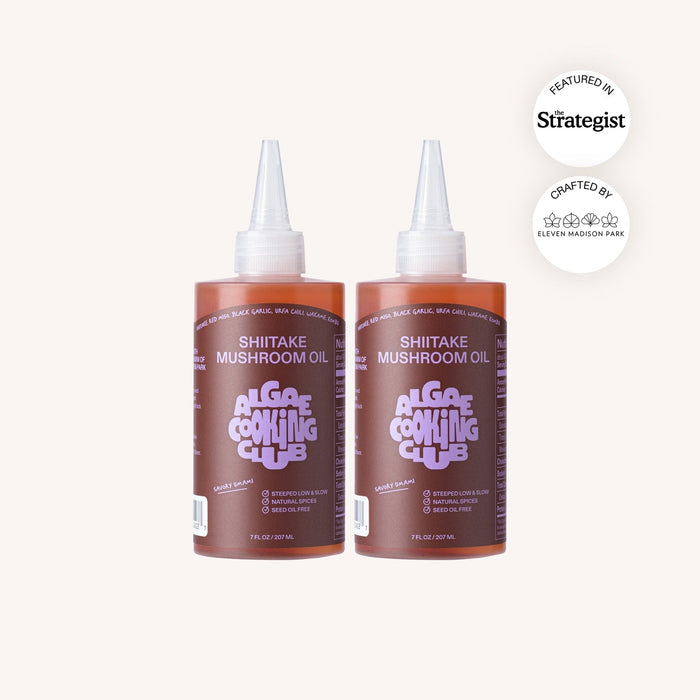 Two bottles of Shitake Mushroom Oil from Alga Cooking Club on a white background with Strategist logo.