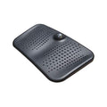 An anti-fatigue mat with a massage ball feature, designed for use at standing desks, in black color.