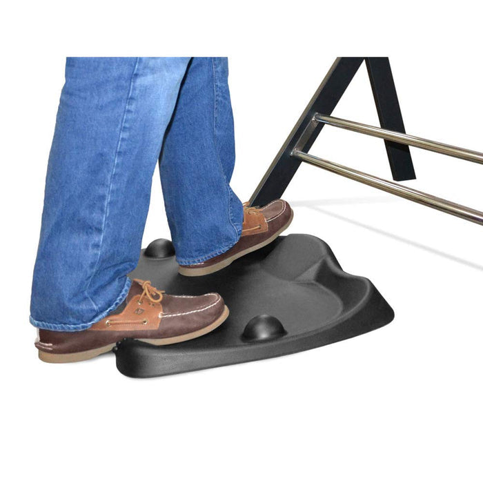 Someone standing on Gelpro newlife cradle standing desk mat on a white surface