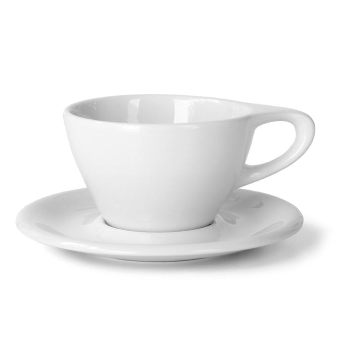 A white ceramic latte cup with a handle, placed on a matching saucer.