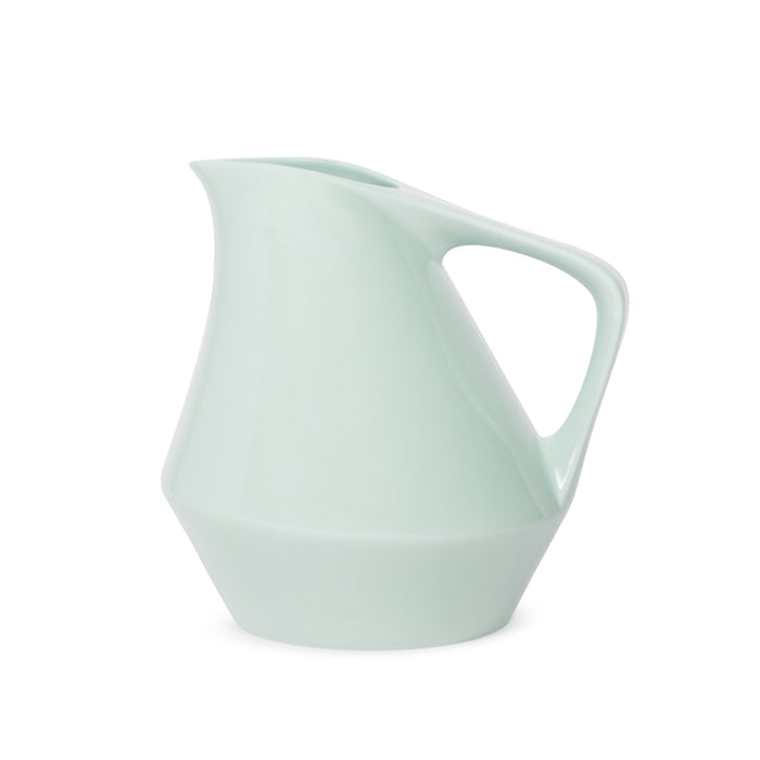 Front view of sage green ceramic pitcher on a white background