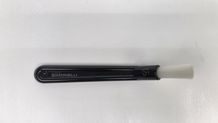 Black brush with white bristle head on a white background