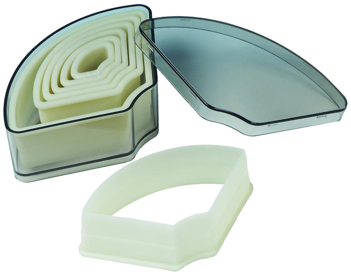 Set of baking molds in a clear case on a white background