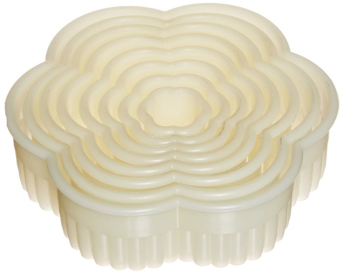 Set of white silicone baking molds on a white background