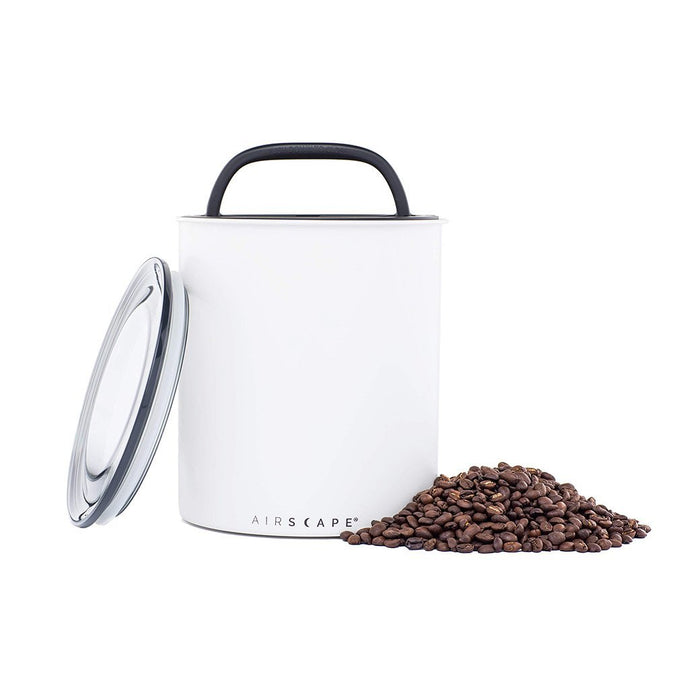 White air-tight canister with handle and 'AIRSCAPE' branding, surrounded by coffee beans on a white background.