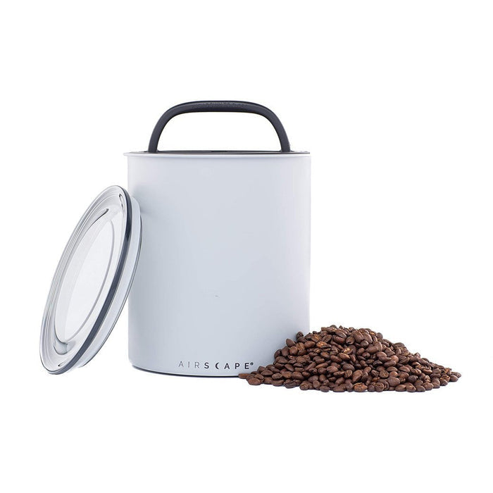 Matte Gray air-tight canister with handle and 'AIRSCAPE' branding, surrounded by coffee beans on a white background.