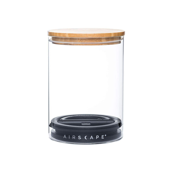 Empty glass airscape jar with both the airtight lid and bamboo lid on a white background