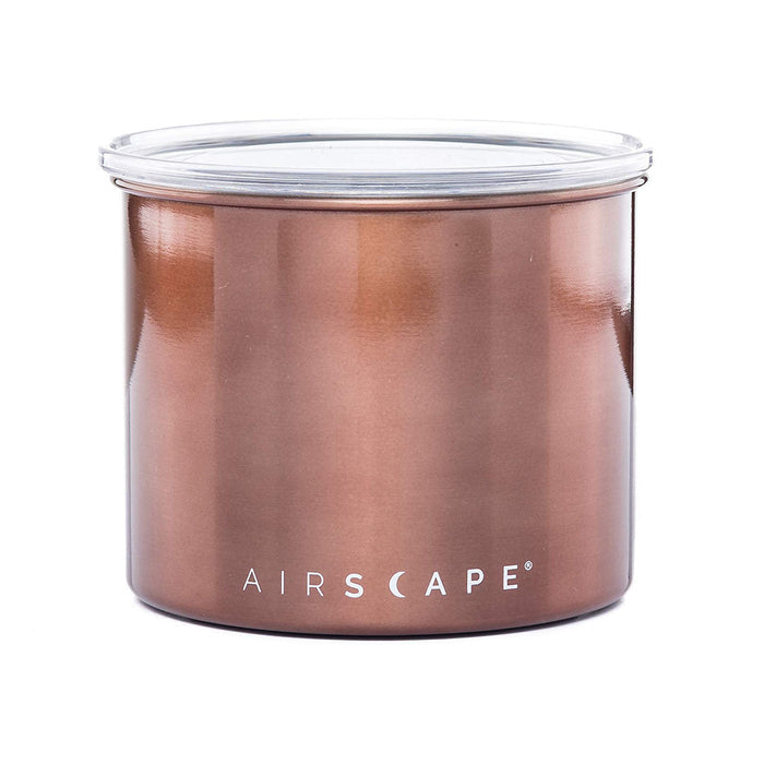Copper-colored coffee canister with lid on a white background