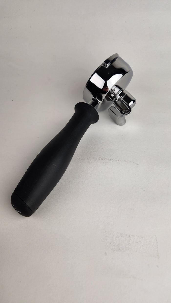 Double spout portafilter with black handle and silver top on a light gray background