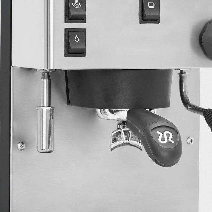 Close-up of a coffee machine with control buttons and brewing lever.
