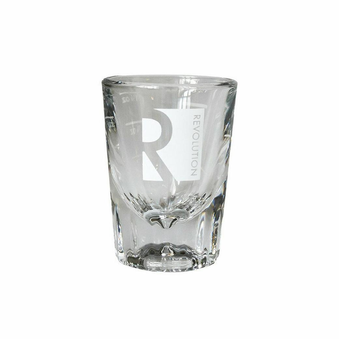 Clear glass shot glass with 'R' and 'Revolution' text on a white background