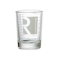 Clear glass tumbler with 'Revolution' branding on a white background