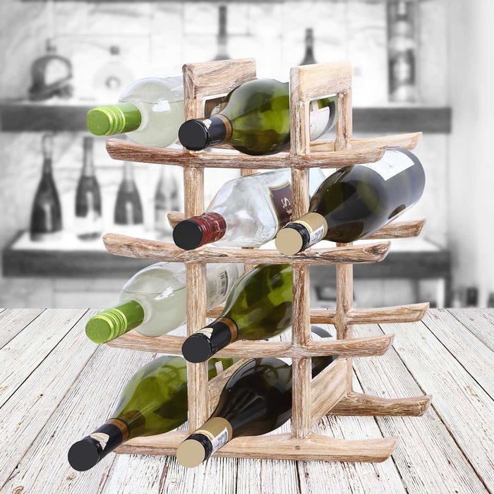 Rico & Plato akio whitewash teak oriental bottle holder with wine bottles inside the holder displayed on a whitewashed wood surface and bar setting background