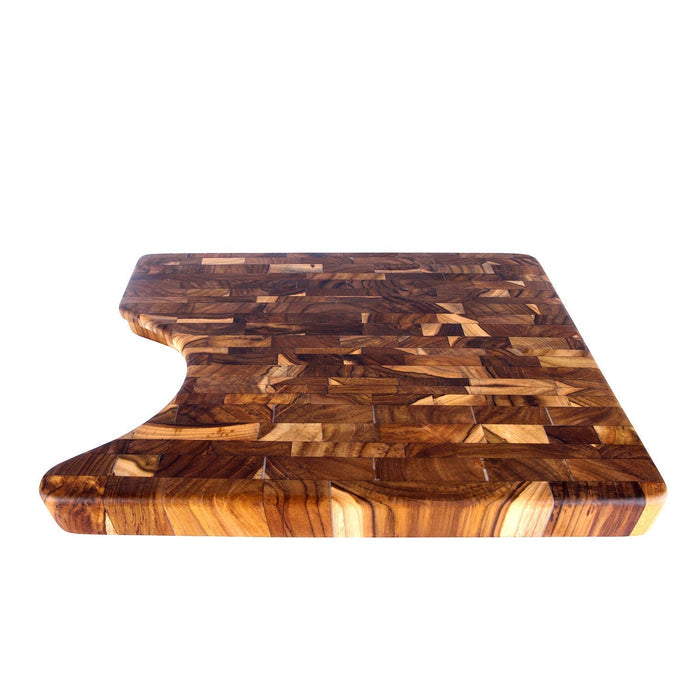 End grain teak cutting board with cutout displayed on a white background