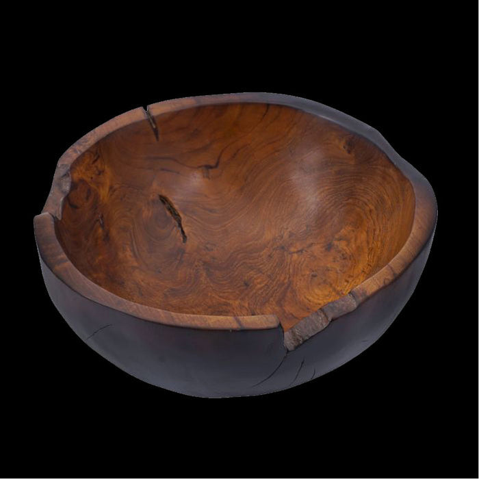Teak bowl with black burned exterior finish displayed on a black background