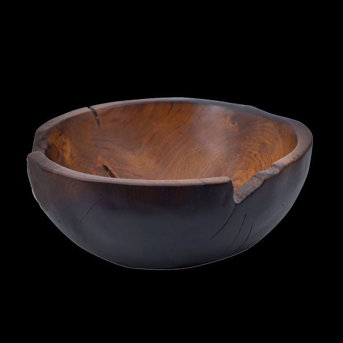 Side view of teak bowl with a black burned exterior finish displayed on a black background