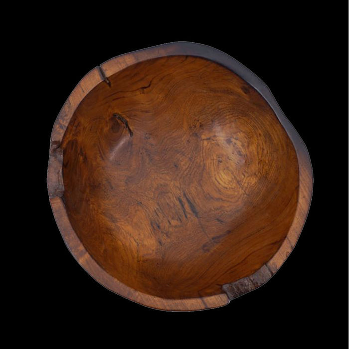 Top view of teak bowl with black burned exterior finish displayed on a black background
