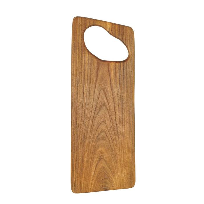 Teak cutting board with hole for handle displayed vertically on a white background