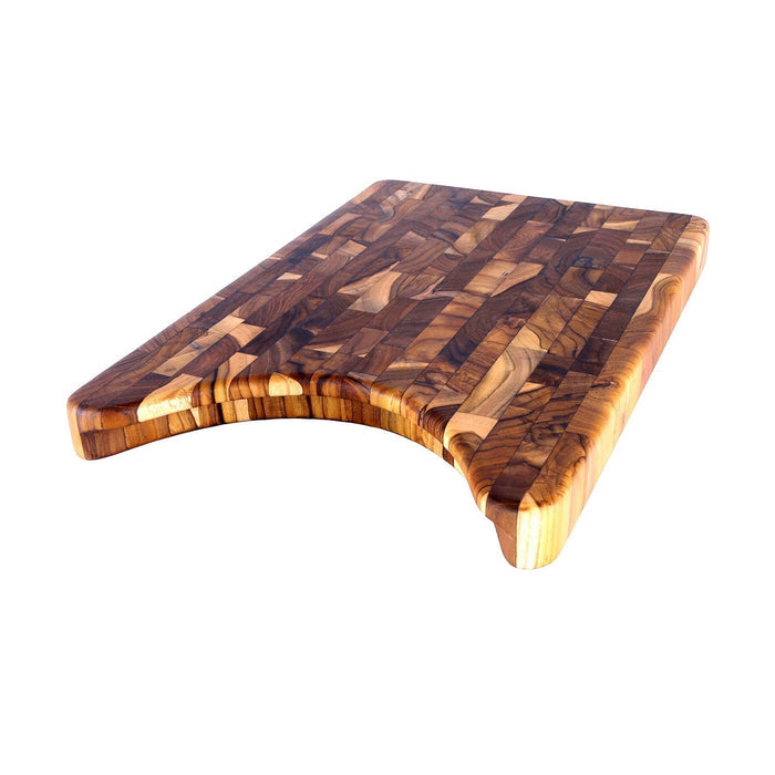 End grain teak cutting board with cut out for plate displayed on a white background