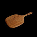 Rico & Plato bayberry teak cutting board serving platter displayed on a black background