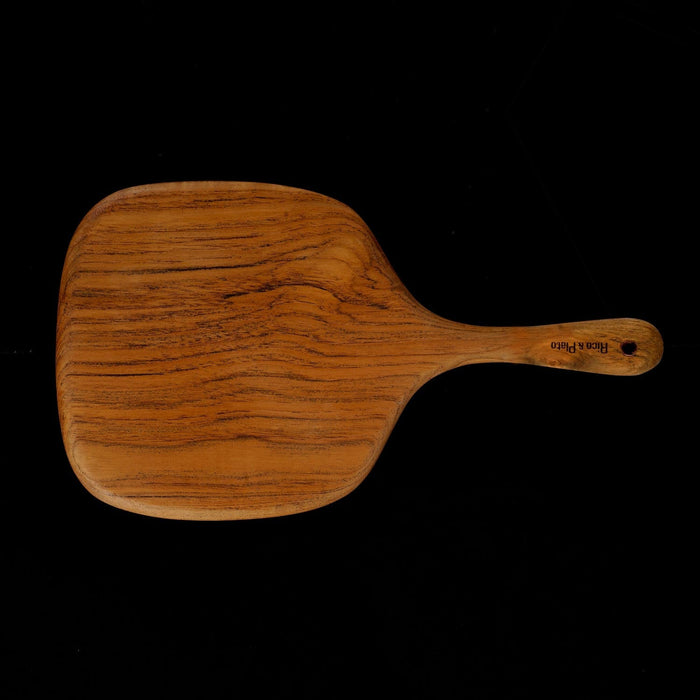 Rico & Plato bayberry teak cutting board serving platter displayed horizontally on a black background