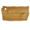 Top view of teak cutting board with a handle on a white background