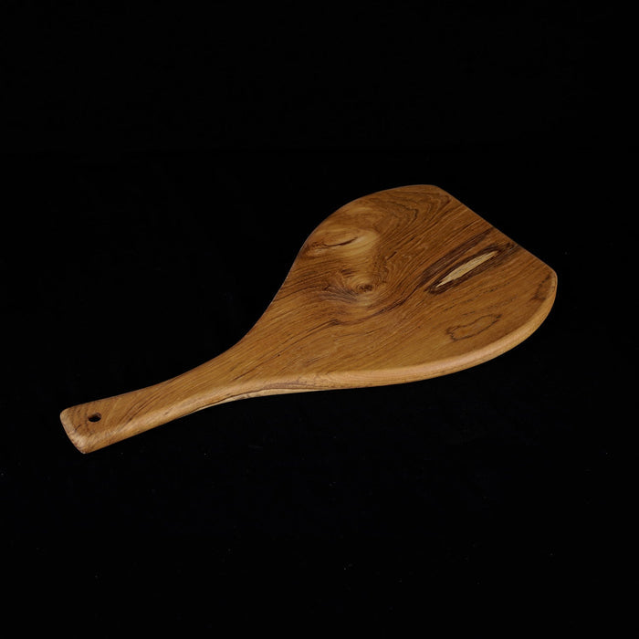 Rico & Plato caraway teak cutting board serving platter displayed on a black background