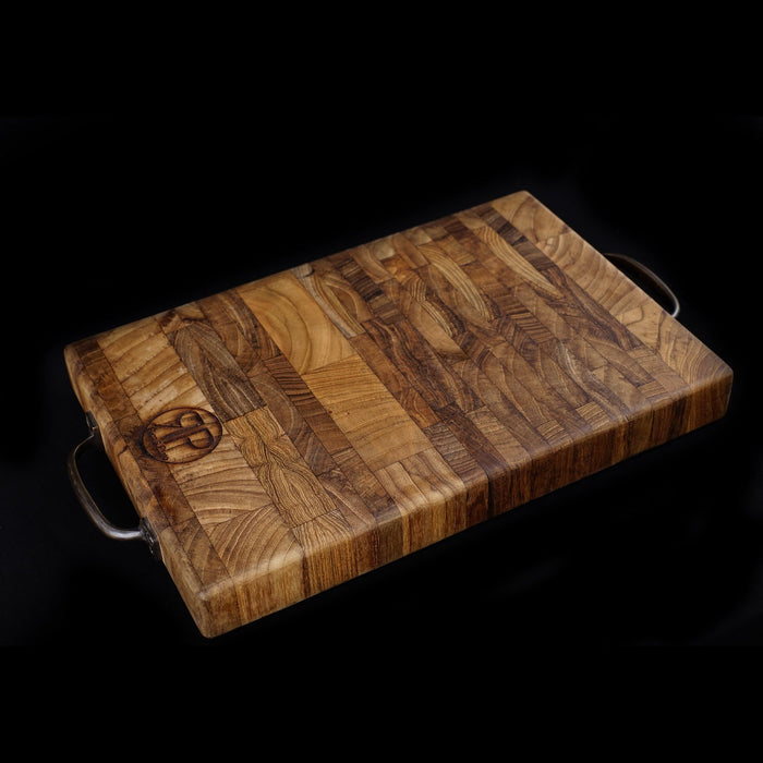 Wooden cutting board with a dark background