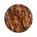 Top view of circular end grain teak butcher block displayed on a white background