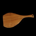 Top view of teak cutting board/serving platter with handle displayed horizontally on a black background